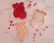 Load image into Gallery viewer, Cherries with Bow Fondant Pop Embosser and Cutter - Made in the UK with Love from House of Toot Sweet - Just £6.50! Shop now at House of Toot Sweet
