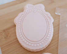 Load image into Gallery viewer, Pearl Frame with Bow Fondant Embosser / Cutter - Made in the UK with Love from House of Toot Sweet - Just £6.50! Shop now at House of Toot Sweet