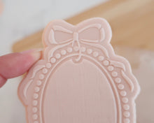Load image into Gallery viewer, Pearl Frame with Bow Fondant Embosser / Cutter - Made in the UK with Love from House of Toot Sweet - Just £6.50! Shop now at House of Toot Sweet