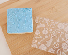 Load image into Gallery viewer, Gym Icons Texture Fondant Cookie Embosser - Made in the UK with Love from House of Toot Sweet - Just £7! Shop now at House of Toot Sweet
